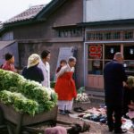 IslBG Locals watch as a gentleman makes his purchase in a busy Chonju marketplace       2/2