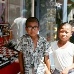 Two boys in front of a Jewelry store.  I still wear a pin  I bought at this store