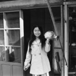 29 A hip young women leaves a Kunsan shop with her purchase