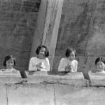 Girls watching from high up in a Chonju sports stadium