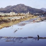 Kimchi pots line the riverbank in the busy city of Chonju.