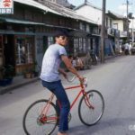 A "slicky boy" with his bicycle near the Kunsan waterfront