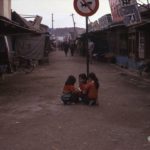 Young girls playing in the middle of a Kunsan street
